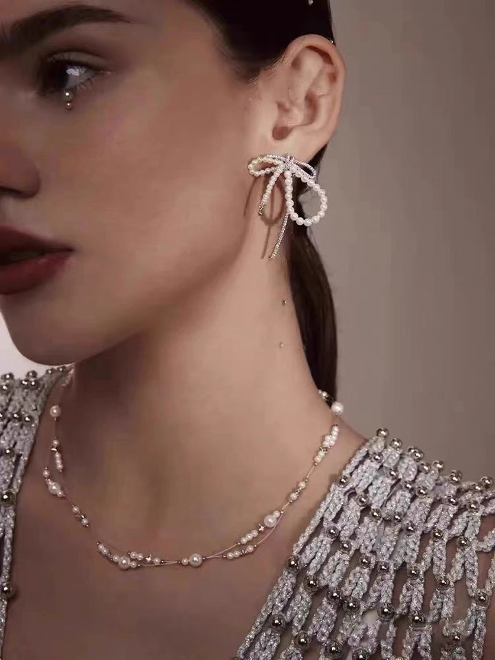 Sterling Silver Bow Pearl Earrings