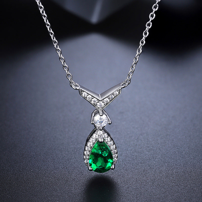 Whale Tail Emerald & Moissanite Necklace