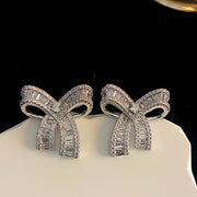 Delicate bow sparkling diamond earrings