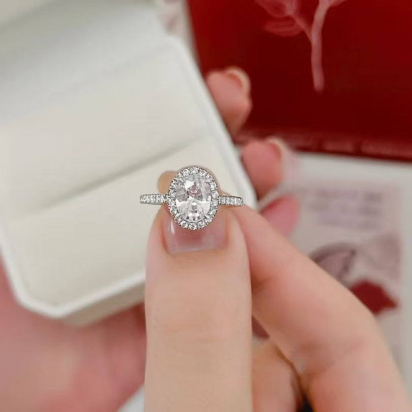 Oval “Pigeon Egg” Halo Moissanite Ring
