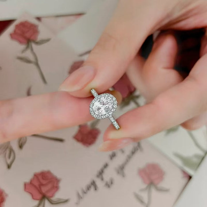 Oval “Pigeon Egg” Halo Moissanite Ring