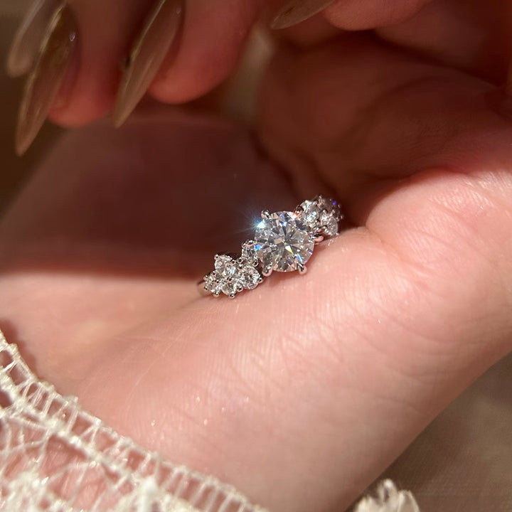 Round-Cut Moissanite Three-Stone Ring — Cluster Side Design